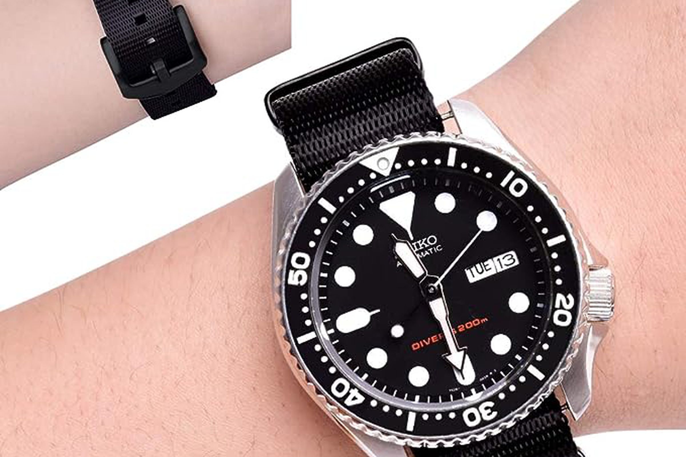 Two wrists, one with watch, other showing buckle of strap